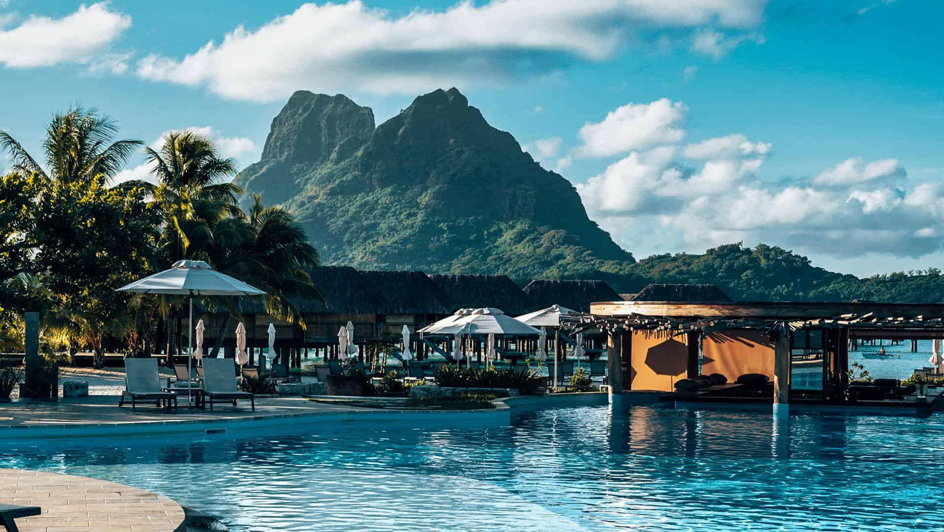 vertical-shot-of-a-resort-with-a-pool-in-bora-bora-landscape