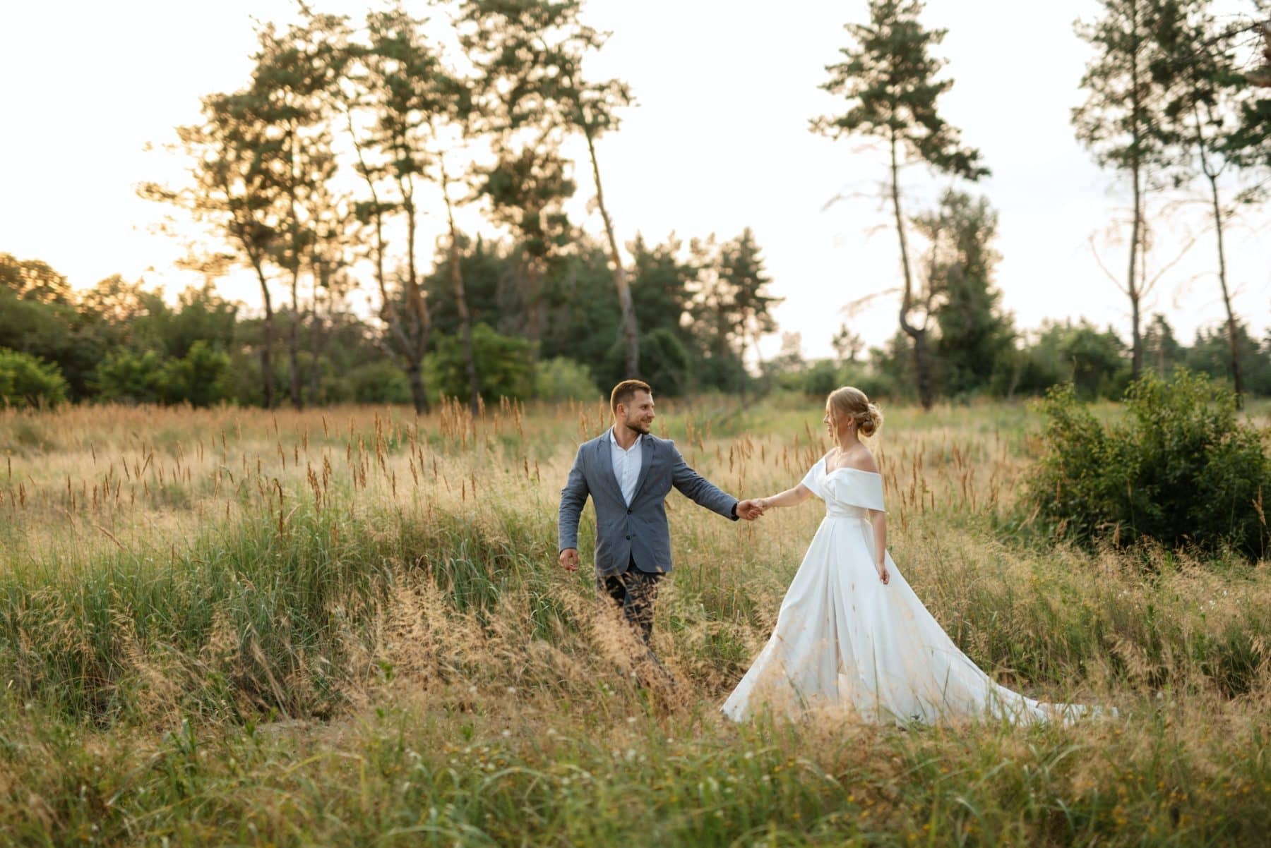 bride and groom on in the woods