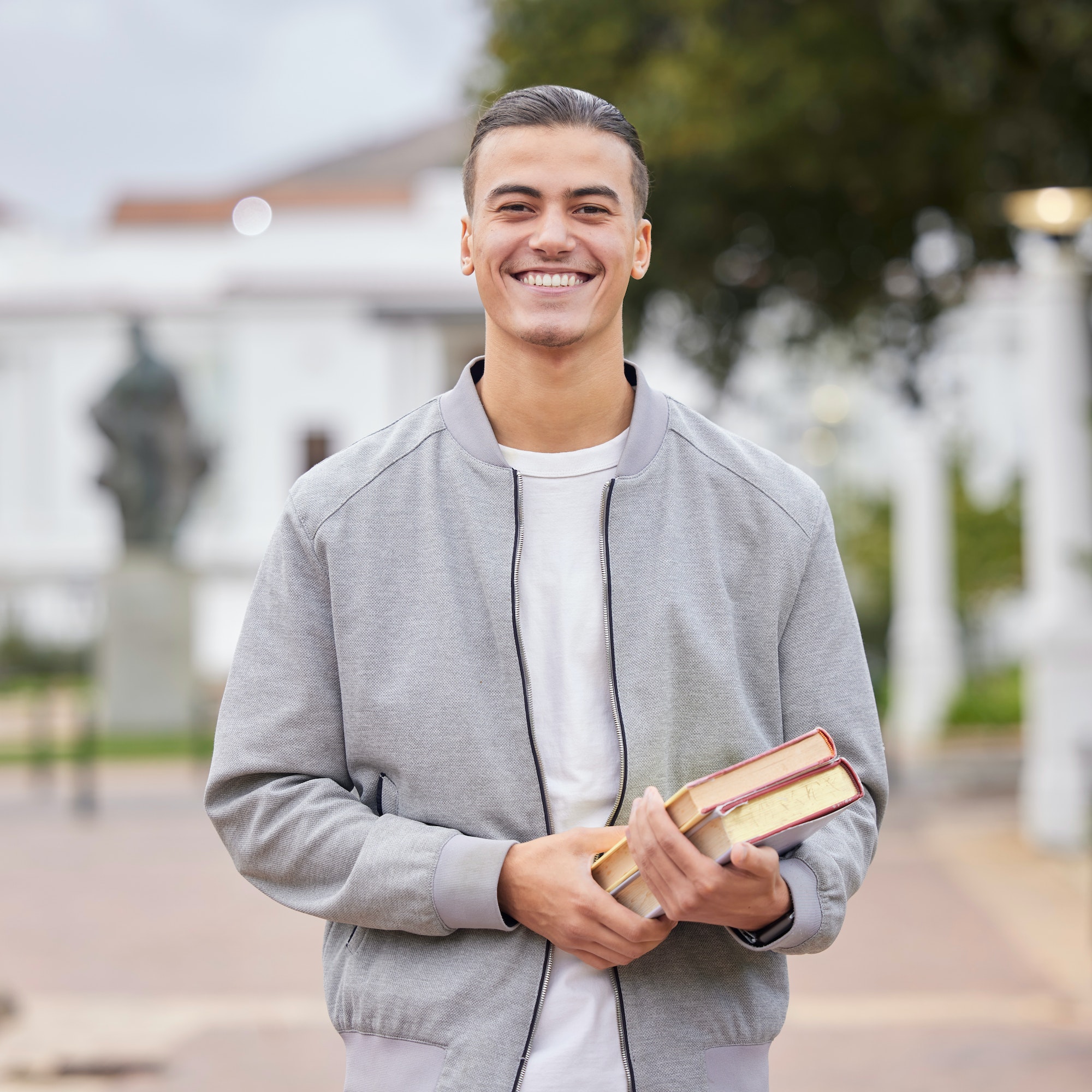 Study, books and student portrait at university, college or campus for research, knowledge and scho