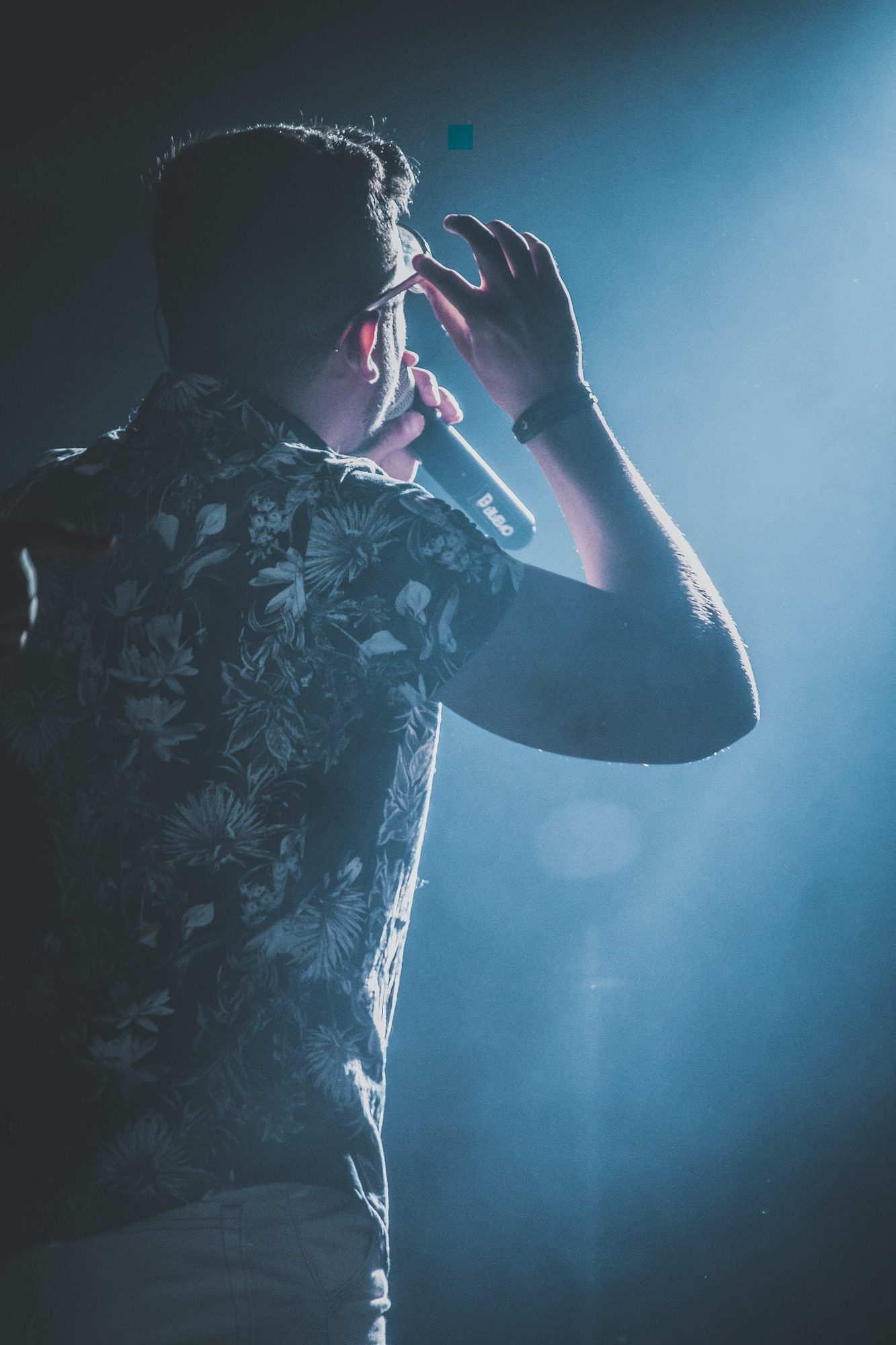 Back view of a man performing on stage