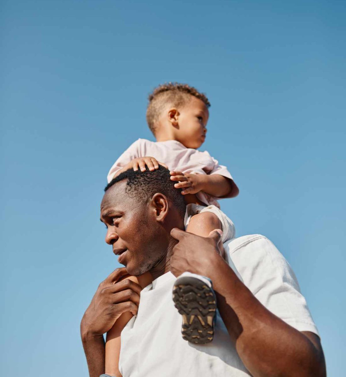 father-and-son-against-sky-66GEHZ4