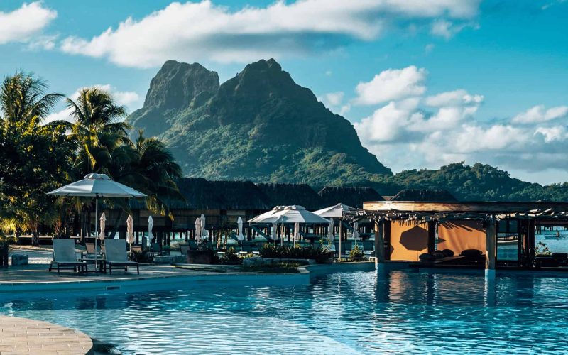 vertical-shot-of-a-resort-with-a-pool-in-bora-bora-landscape